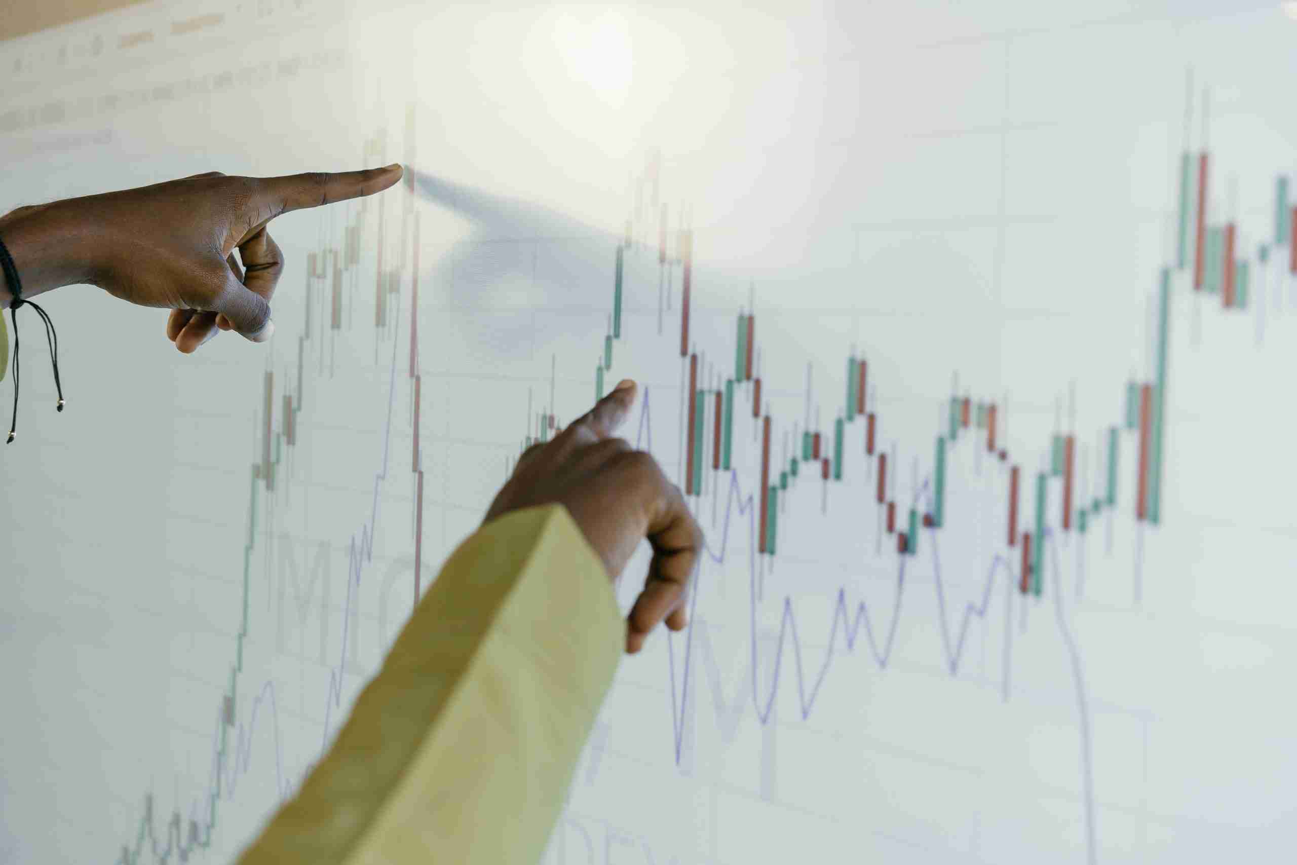 Analysts inspect chart of economic data