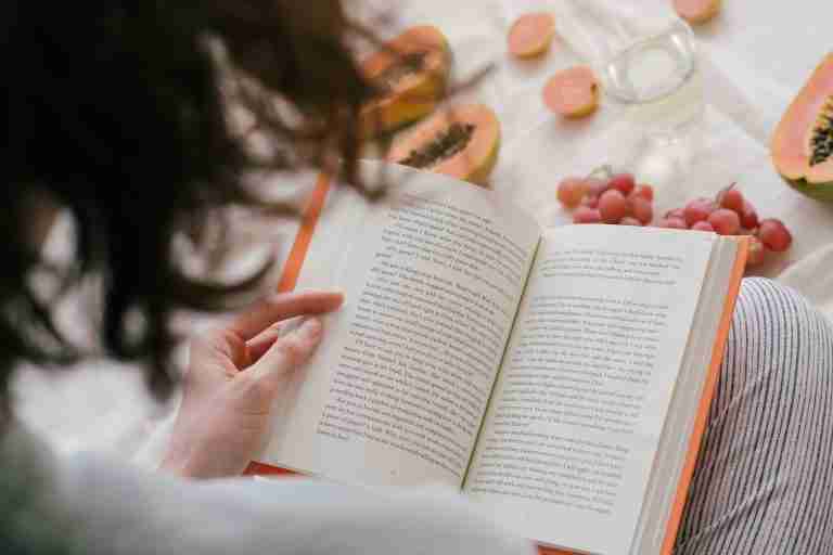 Person reading a book alone