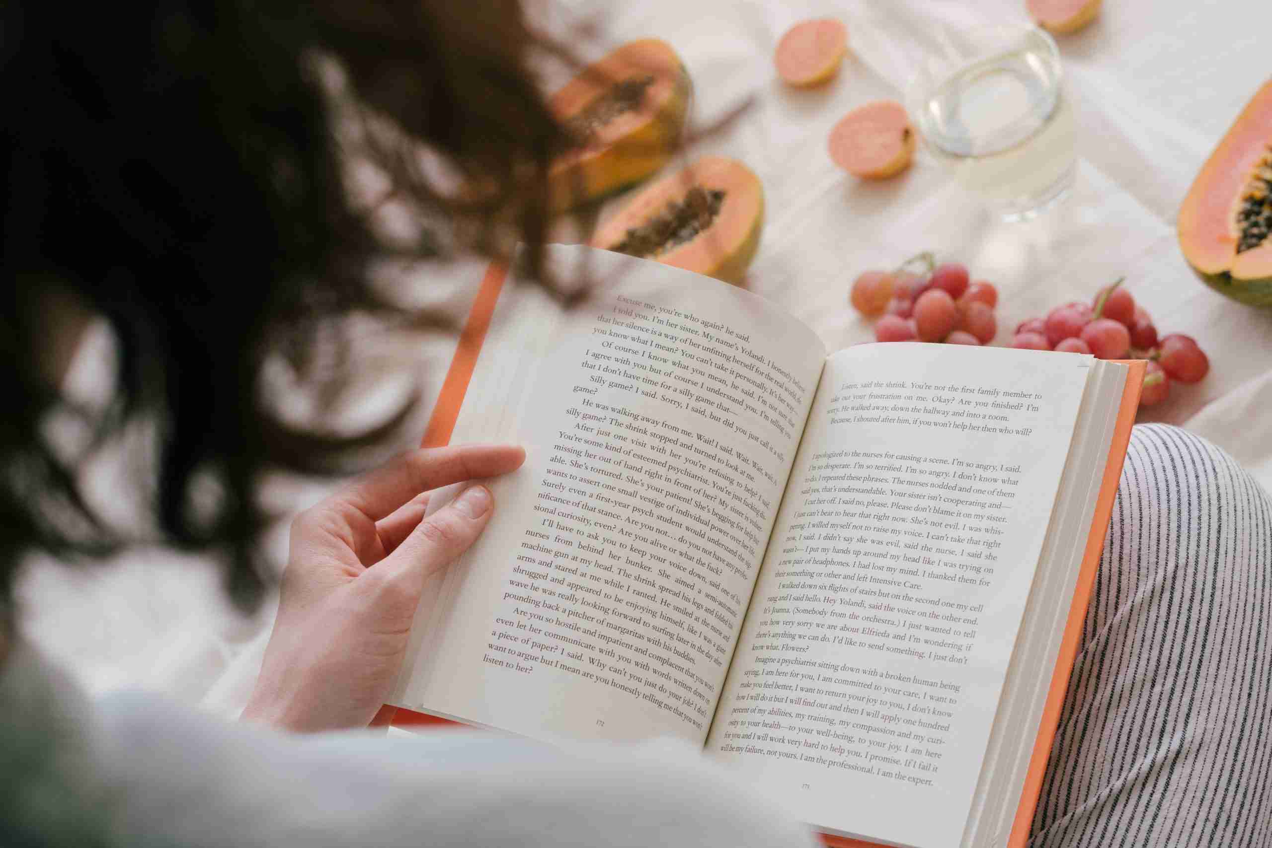Person reading a book alone