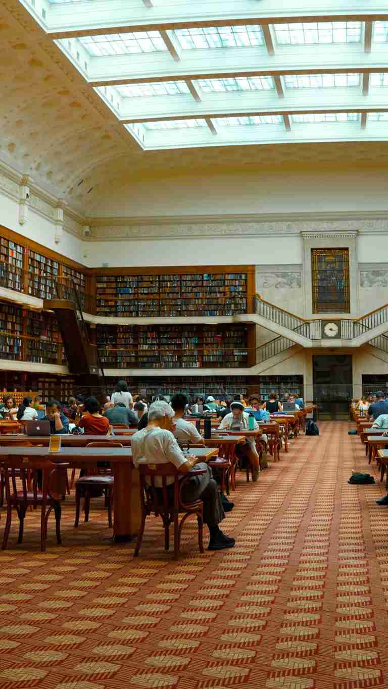 Interior of a library with students studying