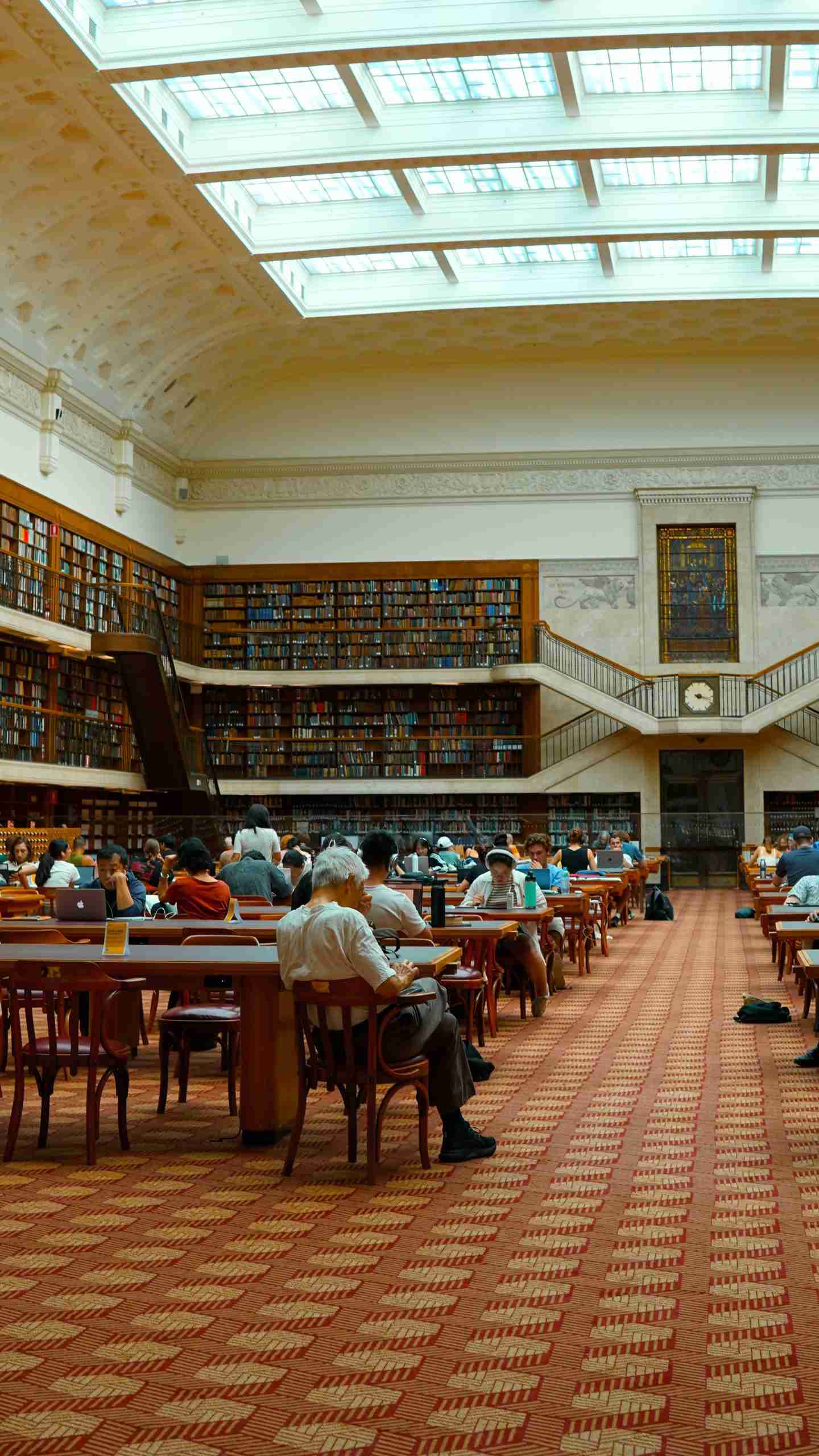 Interior of a library with students studying