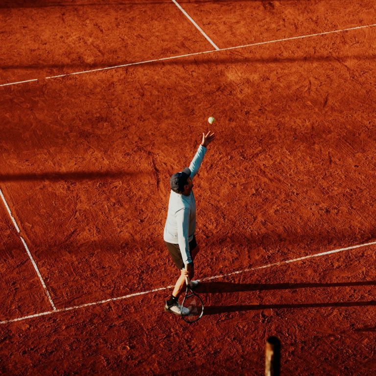 Tennis player serving